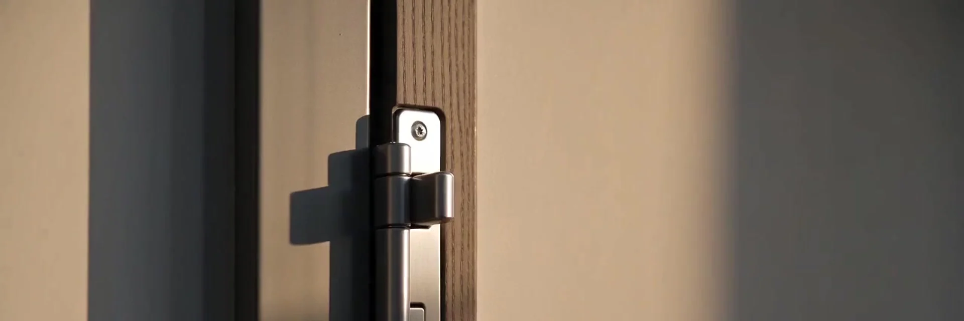 Locksmith checking a door lock, representative scene: Fitting a lock in an armoured door