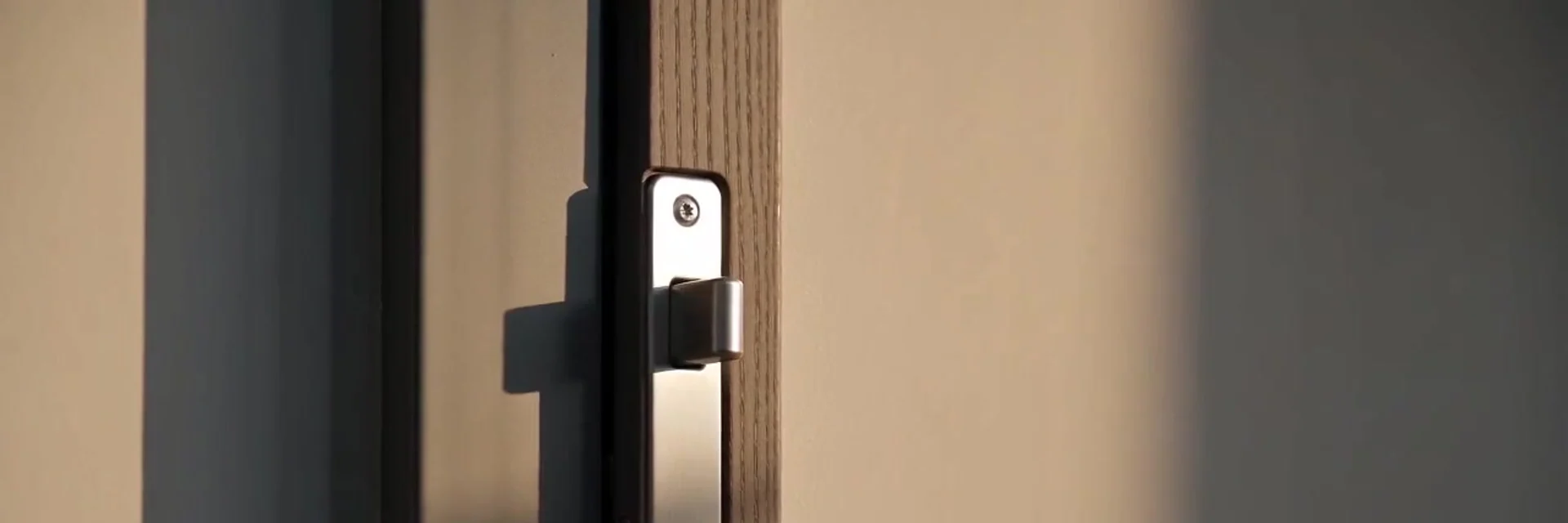 Locksmith checking a door lock, representative scene: Locksmiths in Lleida: what sets us apart
